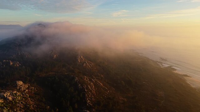Foggy Clouds Over Mountain Hikes In Miradoiro Monte Louro At Sunrise In Louro, A Coru&ntilde;a, Spain. Aerial Drone Shot