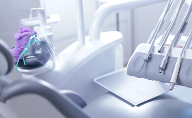 Dental clinic equipment with protective shield in clean modern environment