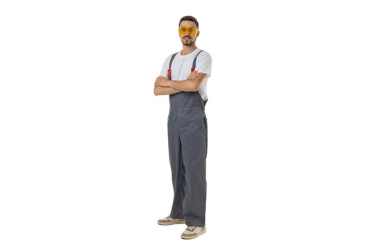 Worker with crossed arms in safety glasses, isolated on white, PNG