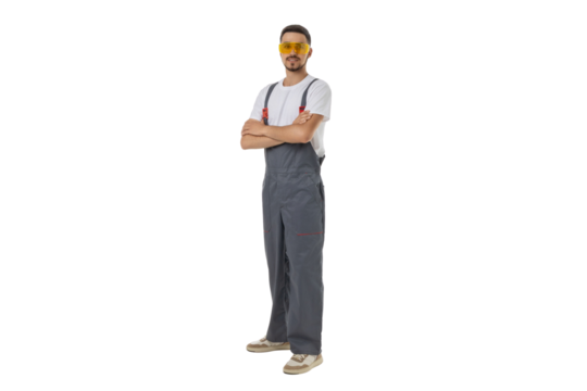 Worker with crossed arms in safety glasses, isolated on white, PNG
