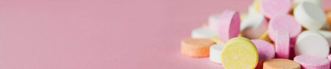 Ultra wide banner with heartburn relief tablets, panorama image for website of doctor's medicinal practice, pharmacy or supplements online shop, banner with acid reflux medication on pink background