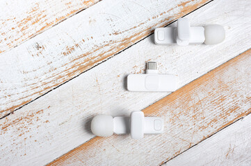 Two wireless microphones and a transmitter for your phone.