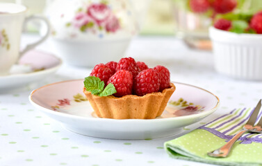 Mini tart with raspberries fruits on the table
