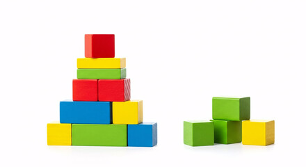 Obraz premium Pyramid of colorful wooden blocks and a small stack of blocks on a white background studio shot