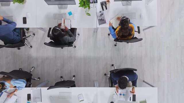 People, call center and above for contact, group or customer support with pc at investment company. Men, women and consultant team in office, voip headset or financial advisory services at agency - Powered by Adobe