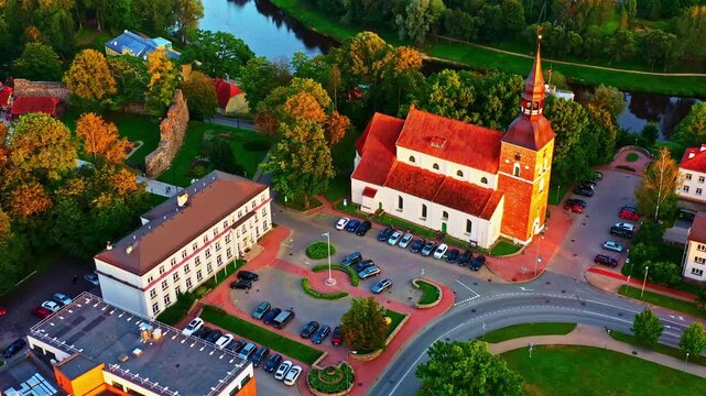 Valmiera city center with evening golden hour glow on St Simon's church and City Hall
