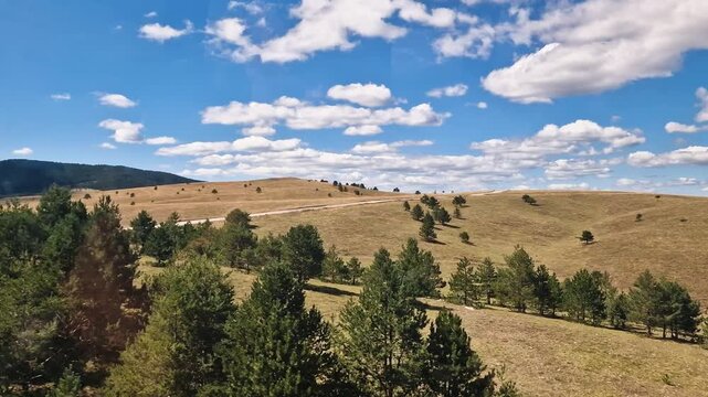 Gondola View of PIcturesque Landscape of Zlatibor Mountain Serbia on Sunny Summer Day