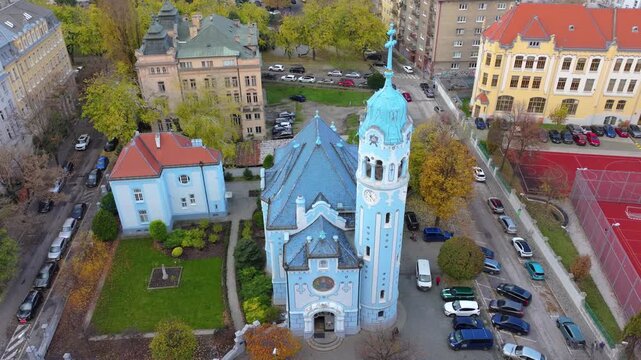 4K cinematic drone footage of the Blue Church in Bratislava, highlighting the building&rsquo;s distinctive blue colors, decorative mosaics, and curved architectural shapes in the heart of Bratislava._18
