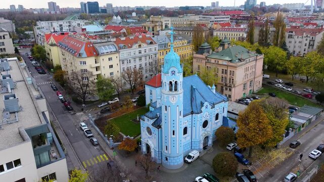 4K cinematic drone footage of the Blue Church in Bratislava, highlighting the building&rsquo;s distinctive blue colors, decorative mosaics, and curved architectural shapes in the heart of Bratislava._01