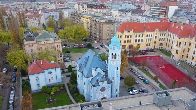 4K cinematic drone footage of the Blue Church in Bratislava, highlighting the building&rsquo;s distinctive blue colors, decorative mosaics, and curved architectural shapes in the heart of Bratislava._12