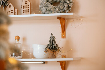 Winter holiday decorations including mini trees, house ornaments, and festive garland lights