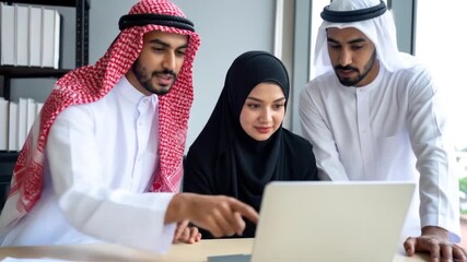 Arab Teamwork on Laptop. - Powered by Adobe