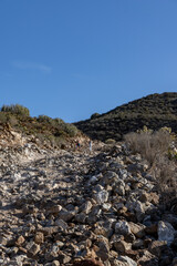 A mountain road with tourists and cacti on Mount Guaza. Tenerife, Los Cristianos, Canary Islands.