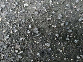 Close up of wet road after rain, background texture