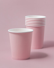 Disposable light pink paper cups closeup, mockup, copy space. No plastic biodegradable single-use