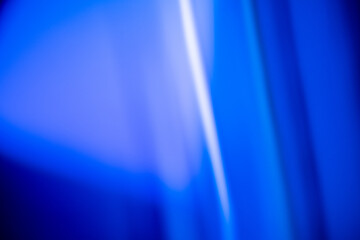 abstract blue light patterns creating a soft, ethereal atmosphere with blurred lines and gradients, neutral background, clear negative space, clean composition, balanced framing, minimalist layout