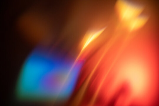 abstract blurred lights creating a vibrant and colorful background with warm tones and soft edges, neutral background, clear negative space, clean composition, balanced framing, minimalist layout