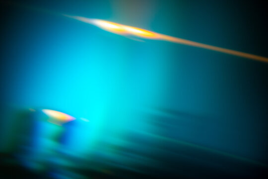 abstract blurred background with vibrant blue and yellow tones creating a dynamic visual effect, neutral background, clear negative space, clean composition, balanced framing, minimalist layout