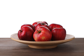 Ripe red apples on wooden table against white background, closeup