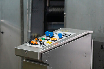 Control panel of an industrial machine in close up view.