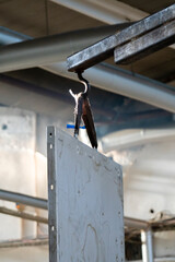 Close up view of transporting a metal part with a forklift.
