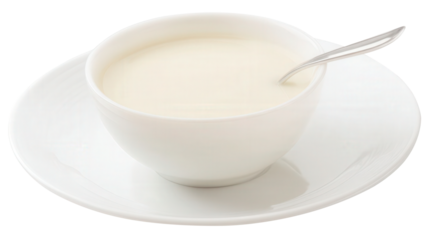 Cedar milk in a small bowl on a clean white plate with a spoon isolated transparent background. Generative AI