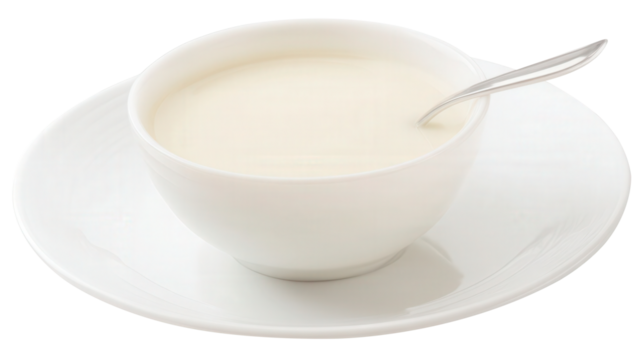 Cedar milk in a small bowl on a clean white plate with a spoon isolated transparent background. Generative AI