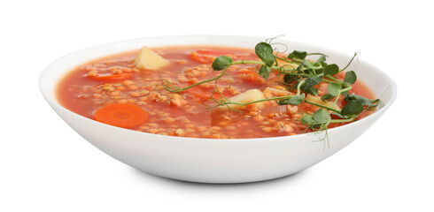 Delicious lentil soup with vegetables in bowl isolated on white