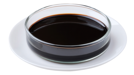 Balsamic vinegar in a small clear bowl on a white plate isolated with a transparent background. Generative AI