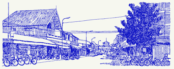 Obraz premium A blue and white drawing of a street with a building and a tree. There are several bicycles parked on the street. vector illustration