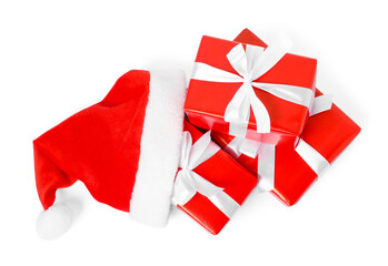 Santa hat and gift boxes isolated on white, top view. Merry Christmas and Happy New Year