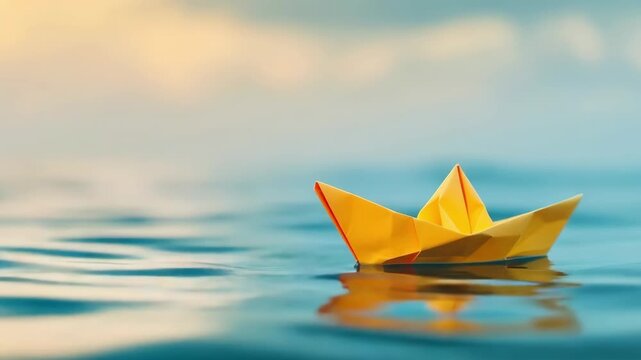 Paper boat sailing on blue boundless water. Small yellow origami boat In big ocean with blue sky and sunshine. Leadership concept with paper ship. Business for innovative solution. Opportunity, vision