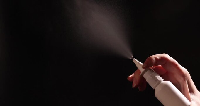 The handling of a vasoconstrictor spray used for treatment. It highlights the health risks of excessive use and addiction concerns related to such drugs.