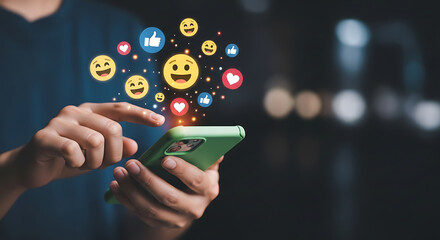 Person interacting with a green smartphone displaying social media emojis and icons around