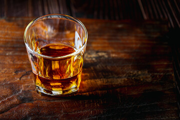 Strong alcohol drink. Whisky in glass, Whisky, bourbon or cognac. Hard strong alcoholic drink