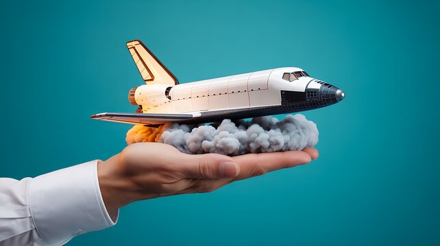 Hand holding miniature space shuttle launching with smoke cloud
- Powered by Adobe