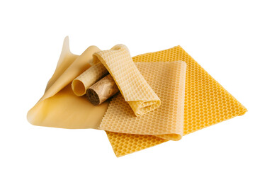 Rolled and unfolded beeswax wraps for food storage isolated on transparent background