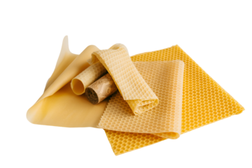 Rolled and unfolded beeswax wraps for food storage isolated on transparent background