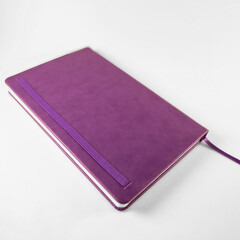 Angled view purple notebook mockup on white background