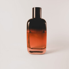 Amber gradient perfume bottle in minimal studio lighting