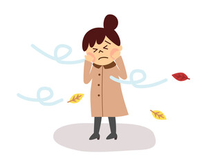 強い風の中で立つ女性