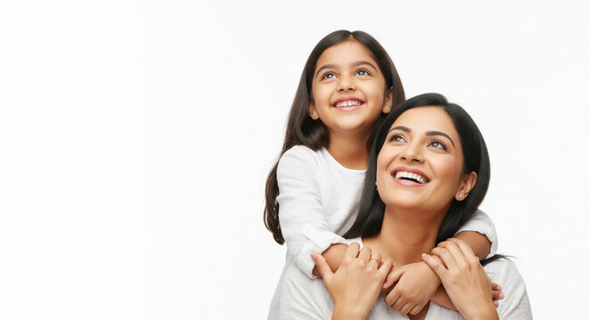 Joyful Indian mother and child smiling, looking upwards