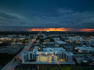 Dramatic storm clouds over Dania Beach area near Miami, Florida during evening aerial view