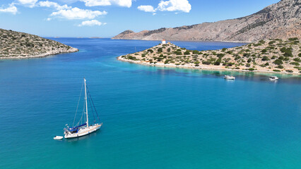 Aerial drone photo of iconic bay of Panormitis a safe anchorage for visitors of Monastery, Symi...