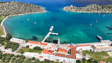 Aerial drone photo of iconic bay and holy Monastery of Archangel Michael Panormitis, Symi island,...