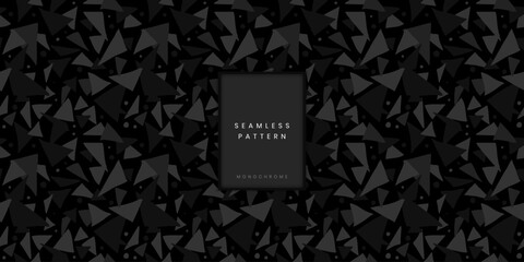Seamless geometric pattern of scattered monochrome triangles on a dark background