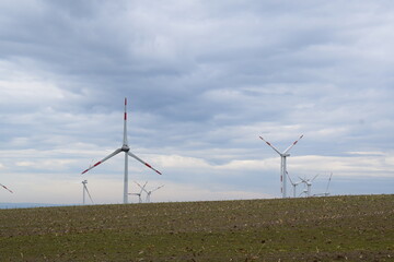 wind power plants behind the hill