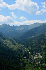 Fototapeta premium View from the top of Mount Nosal. Beautiful panorama of the polish mountains and Kuznice. Tatra National Park, Zakopane, Poland
