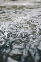 close up of water flow on the rocks