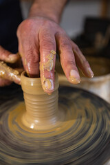 Skilled Potter Shaping Clay on a Wheel